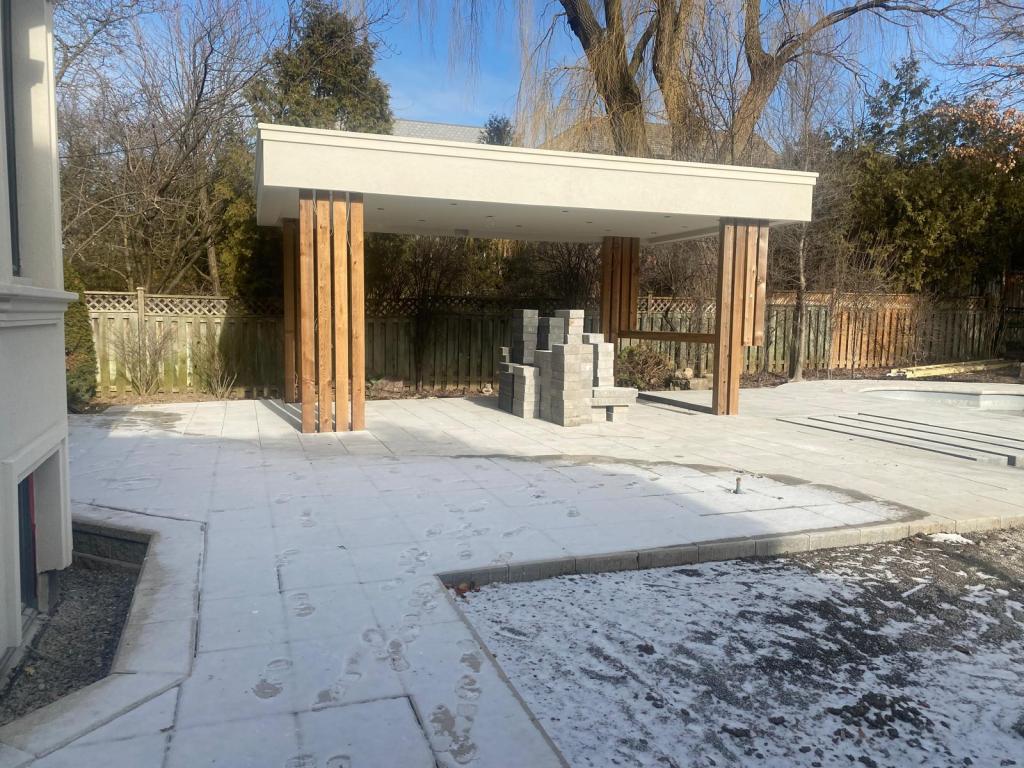 Modern pergola structure on stone patio